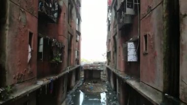 Drone Shoot of Dirty Garbage underline in ally of buildings in chawl system buildings, mumbai city, India. 