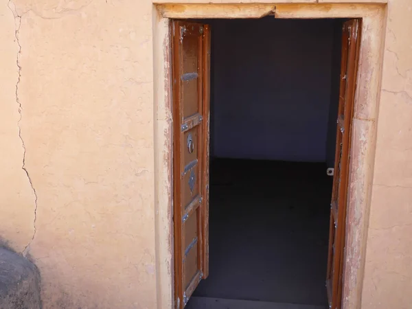 Old Wooden Door in ruined fort in India. Old traditional wooden door in fort.