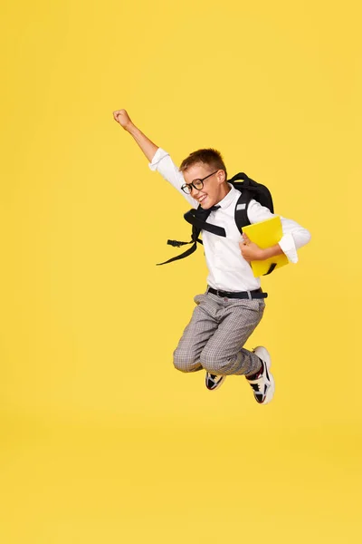 School Break Cheerful Mischievous Schoolboy Uniform Backpack Jumps Yellow Background —  Fotos de Stock
