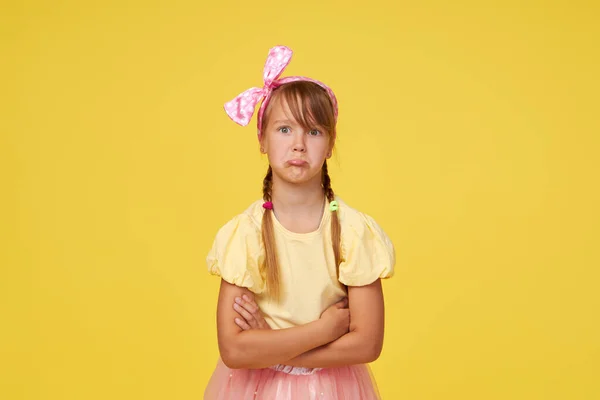 Portrait Offended Little Toddler Girl Child Yellow Background Looking Camera — Φωτογραφία Αρχείου