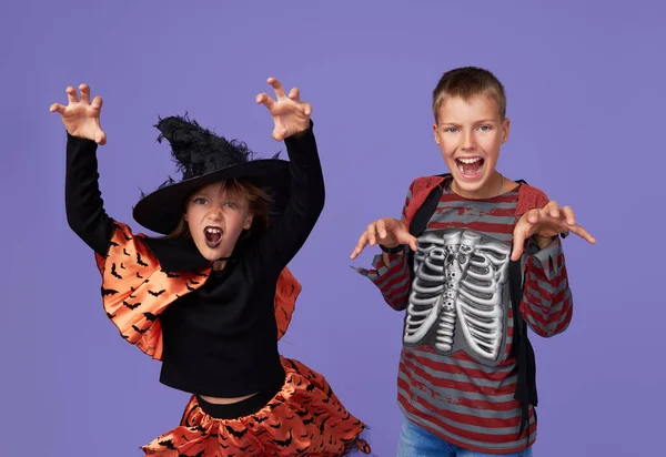 Funny Children Carnival Costumes Skeleton Witch Honor Halloween Purple Background —  Fotos de Stock