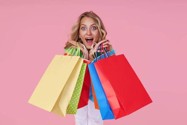 Portrait Excited Joyful Young Woman Colorful Shopping Bags Pink Background — Stockfoto