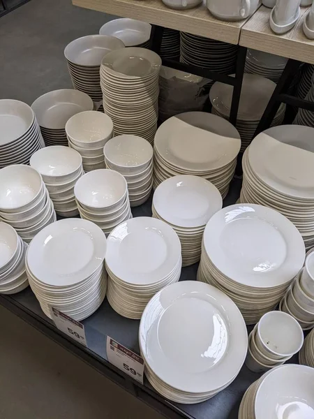 white and gray plates for sale in a restaurant