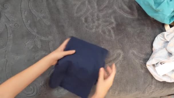 Child Folds Her Clothes — Αρχείο Βίντεο