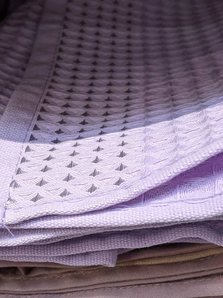 close up of a stack of folded shirts