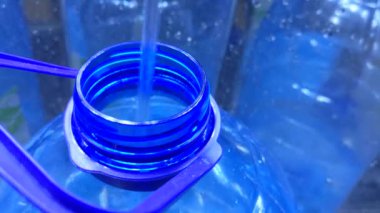 Filling the bottle with water