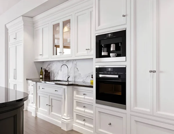 modern kitchen interior with white and black appliances