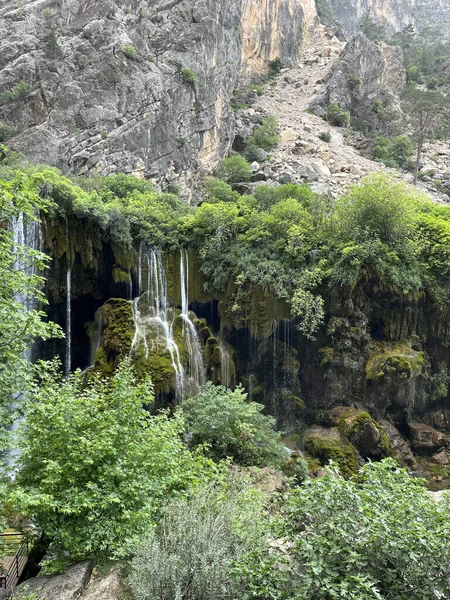 Waterfalls among the rocks. Picturesque nature.