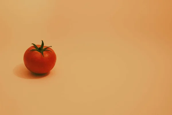 Little Red Isolated Tomato Green Leaves Orange Background — Stock Fotó