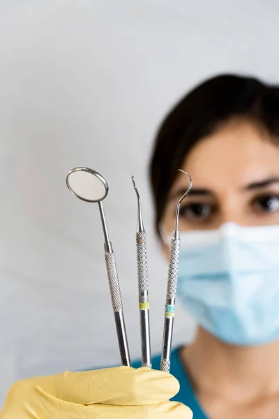 Young Female Dentist Holding Dental Instruments Her Hand Protected Glove — Foto Stock