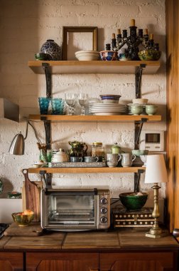 modern kitchen japandi style, shelves in natural wood kitchen, oak, oak, with different ceramic objects, utensils, as well as decorative vases, the kitchen is made of wood as well as the bar.