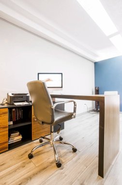 modern designer desk for office, business and creative spaces, with computer and office work elements, for companies, small businesses and enterprises. Wooden desk in black color with storage drawers.