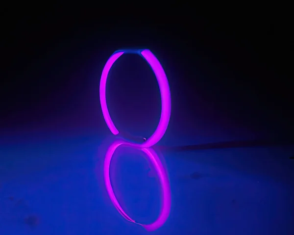 Light Rings Pink Blue Magenta Turquoise Reflections Floor Black Background — Stok fotoğraf