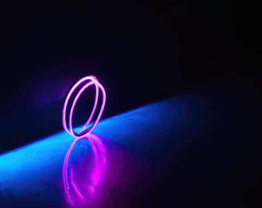 light rings, pink and blue, magenta and turquoise with reflections on the floor, black background, moving light rings, background, wallpaper, wallpaper, mobile background
