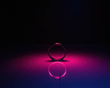 light rings, pink and blue, magenta and turquoise with reflections on the floor, black background, moving light rings, background, wallpaper, wallpaper, mobile background