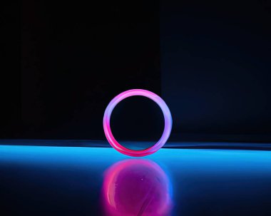 light rings, pink and blue, magenta and turquoise with reflections on the floor, black background, moving light rings, background, wallpaper, wallpaper, mobile background