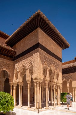 House in tinghir, traditional house of clay and straw. Earth house with blue steel doors. One door open. Morocco, tinghir. Little village, street image. Clay and straw wall with steel door.