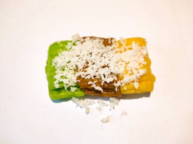 A bunch of Pandan Sticky Rice Cake, filled with brown sugar sprinkled with grated coconut called gethuk, an Indonesian Traditional Snacks