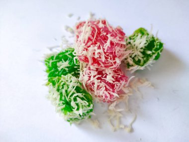 A bunch of Pandan Sticky Rice Cake, filled with brown sugar sprinkled with grated coconut, an Indonesian Traditional Snacks