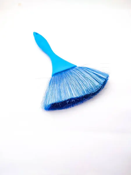 Broom Dustpan Isolated on White Background. Desktop keyboard brush for cleaning up your computer