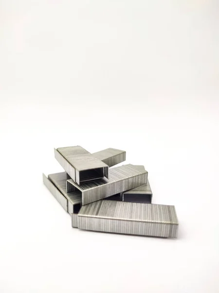 Metal staples for stapler on white background with copyspace