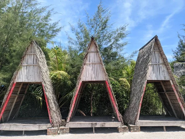 Three Beach Huts Neatly Arranged Beautiful Cypress Trees Blue Sky — Zdjęcie stockowe