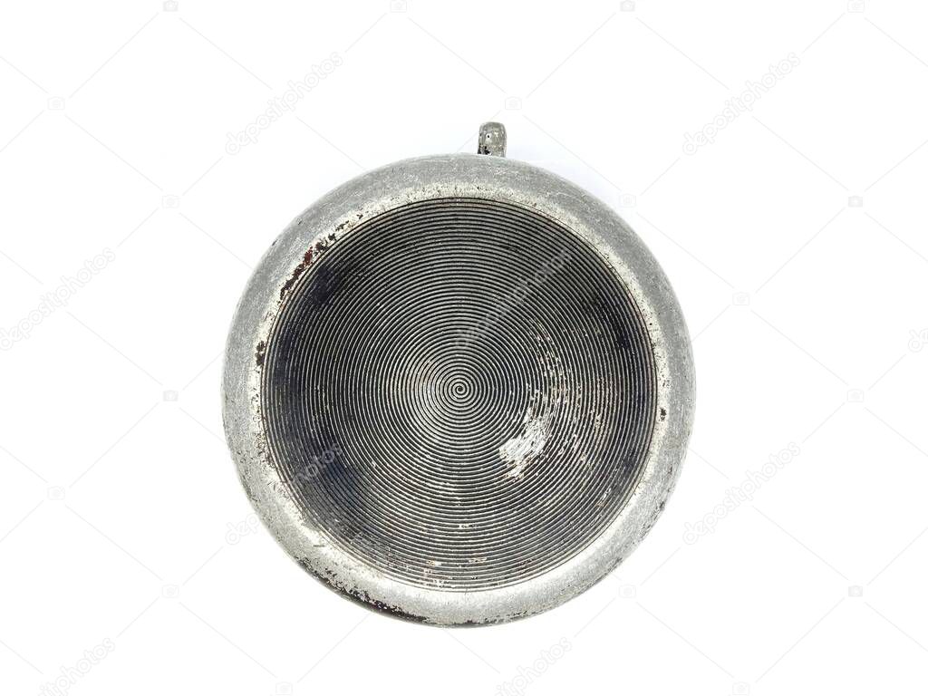 Old round cast iron pan isolated on white.Top view