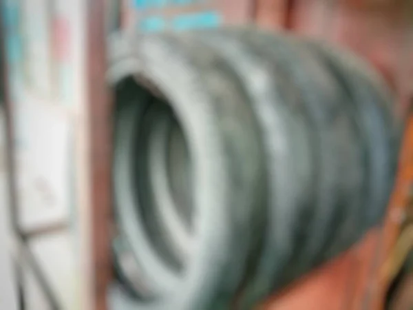 Defocused abstract background of used bike tires.Blurry objects.Blurred worn bike tires.
