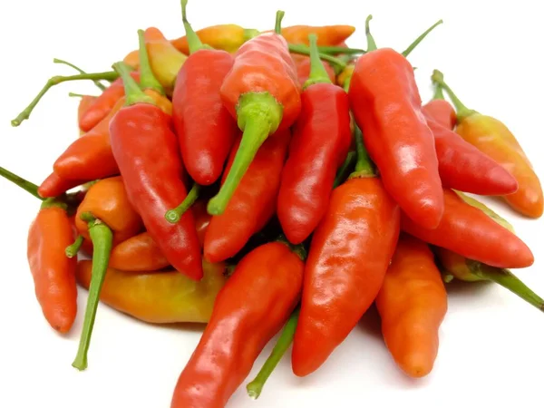 Stack of red hot cayenne peppers isolated on a white background.Fresh red peppers on white clipping path background