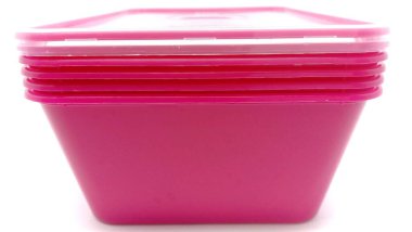 Stack of pink food plastic containers.Close up