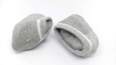roll of grey short socks isolated on white background