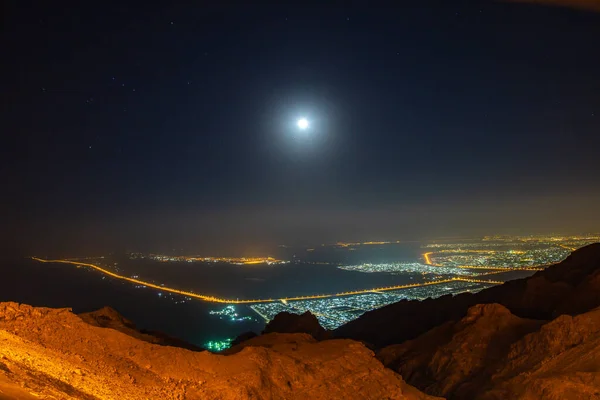 moon in the night with the sky in the evening, the city of the mountains, the stars,
