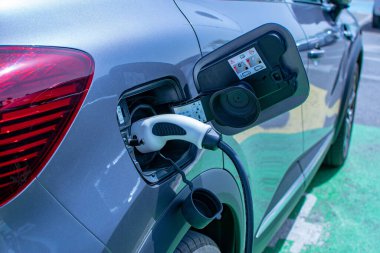 electric car charging batteries in a parking