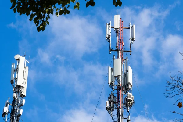 Telecommunication tower of 4G and 5G cellular communication. Cellular base station. Wireless antenna transmitter. Telecommunications tower with antennas against the blue sky