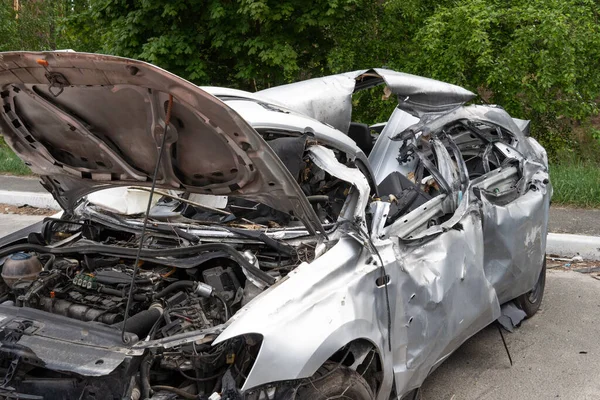 war in Ukraine. Car graveyard. Cars of civilians were shot. Russias war against Ukraine. Exploded car. Cars damaged after shelling. irpin bucha. war crimes.