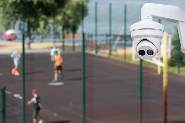 Outdoor CCTV monitoring, security cameras at a school playground.