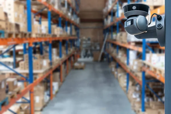 Video surveillance at an industrial enterprise. The video camera captures what is happening in the room around the clock. Installation of a video surveillance system in a warehouse.