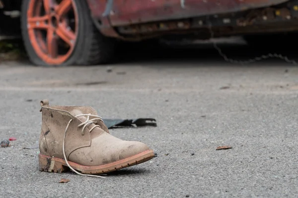 KYIV REGION, UKRAINE 05.04.2022 Irpin, Bucha, Dmitrivka. Atrocities of russian army in the suburbs Kyiv. Childrens shoes from civilian car, fired upon, burned by russian soldiers. War russia Ukraine.