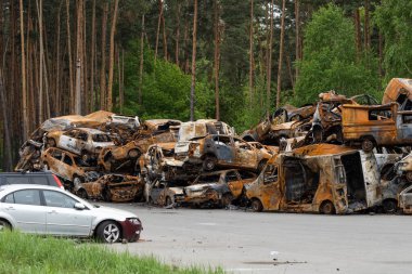 Cars of civilians were shot. Russias war against Ukraine. Burnt and blown up car.