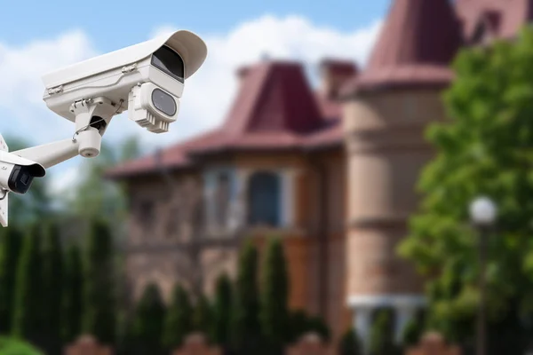 Security camera and private house on the background