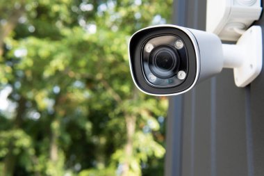 IP CCTV camera install by have water proof cover to protect camera with home security system concept with blur background.