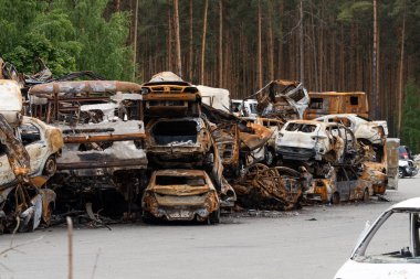 Cars of civilians were shot. Russia's war against Ukraine. Burnt and blown up car.