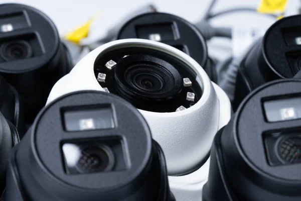 Close White Security Camera Surrounded Black Cameras — Stockfoto