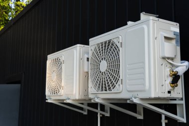 The outdoor unit of the air conditioner compressor is installed outside the house
