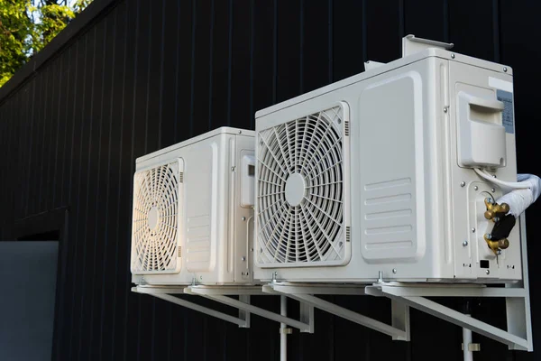The outdoor unit of the air conditioner compressor is installed outside the house