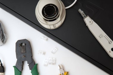 Modern security cameras and video recorder on the table. Video surveillance concept background. CCTV Installation concept. Service for installing CCTV cameras.