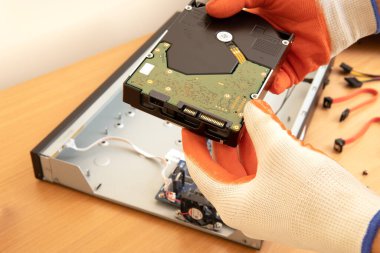 technician or engineer installs hard drive in cctv, cctv system.