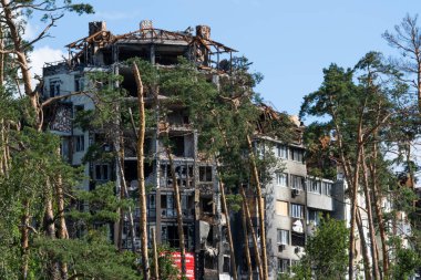 The ruins of multi-storey buildings after the shelling. Burnt houses due to explosions. The house was damaged by bombs and aircraft. War between Russia and Ukraine, Irpin-Bucha, April 10, 2022