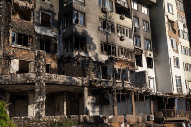 The ruins of multi-storey buildings after the shelling. Burnt houses due to explosions. The house was damaged by bombs and aircraft. War between Russia and Ukraine, Irpin-Bucha, April 10, 2022