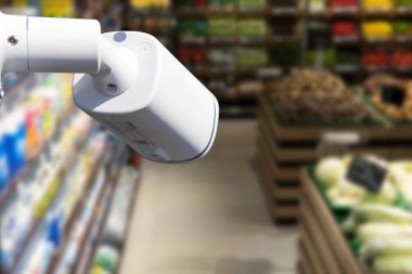 Alışveriş merkezinin arka planındaki CCTV kamera sistemi güvenliği bulanık insanlar ve alışveriş merkezinin soyut geçmişi